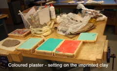 Coloured plaster setting on imprints