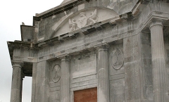 Heraldic statues above entrance - dry moat