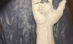 Chisselling the plaster waste mould Chisselling the plaster waste mould
