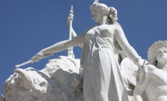 Repaired marble statue with staff and wreath tip