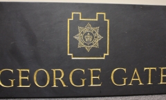 Carved name and shield Carved name and shield