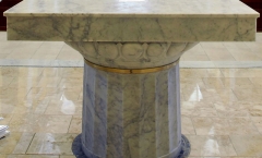 Carved altar with brass band